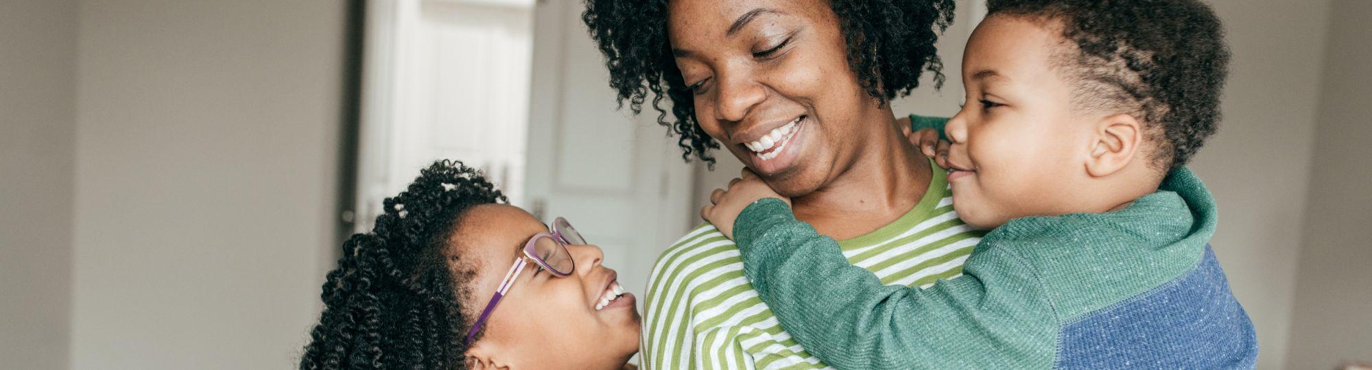Smiling mother with two children